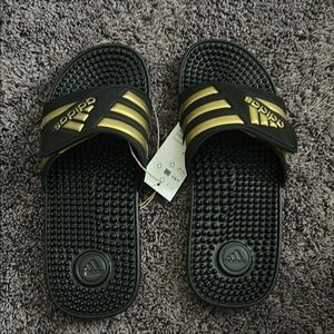 Adidas Black Slides with Gold Stripes